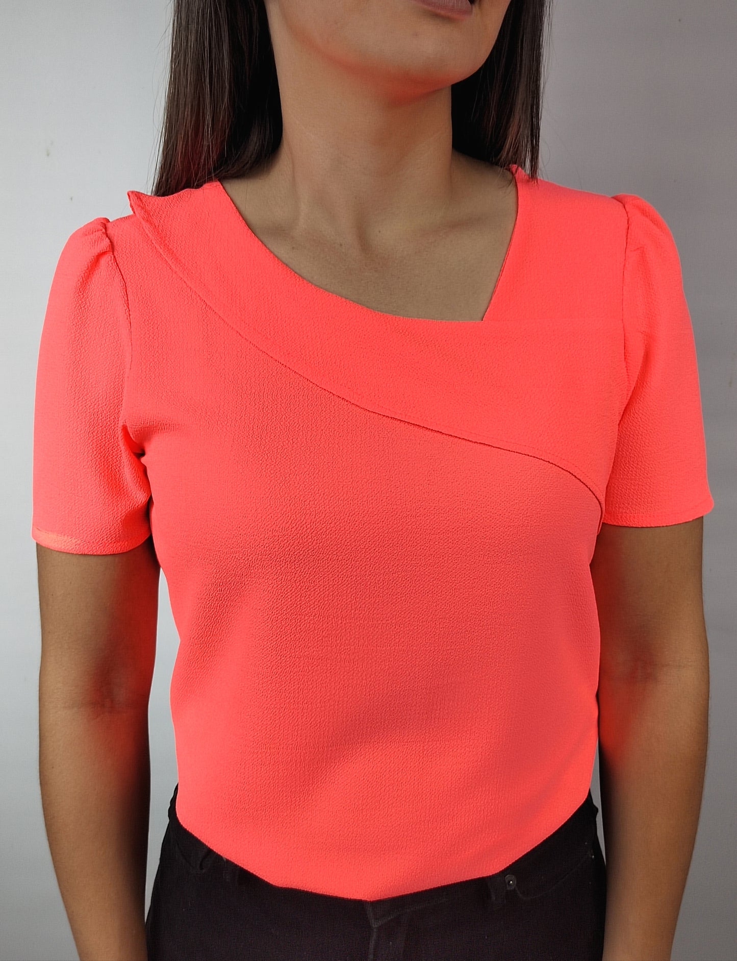 Blusa vuelo naranja neón